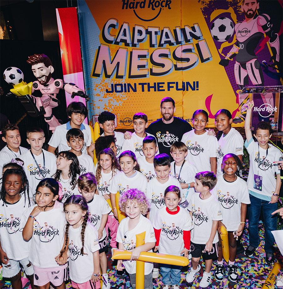 Lionel Messi at launch event with a group of kids